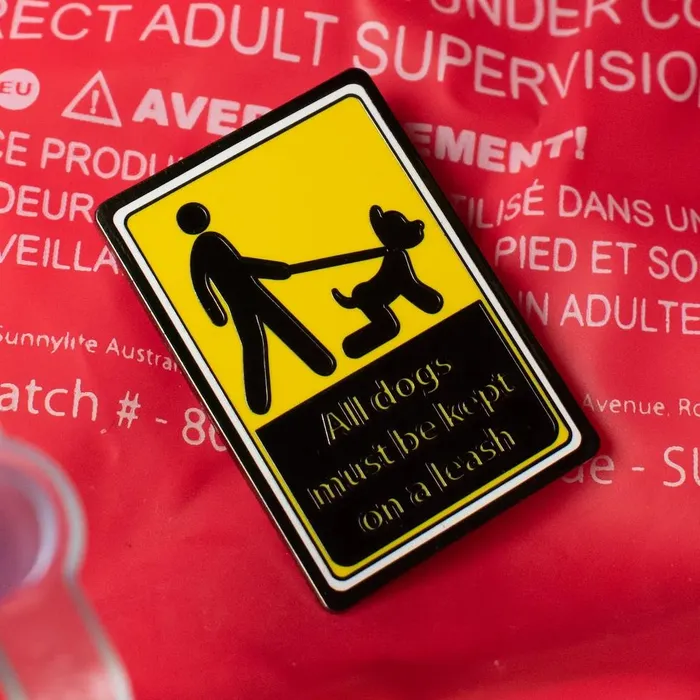 Vibrators James Newland Illustration Keep Your Dog Leashed Sign Enamel Pin